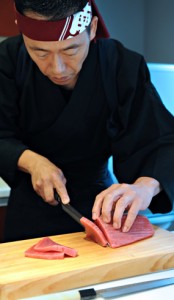 Slicing maguro 'tuna' with a knife from Unique Japan